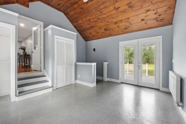 a view of a livingroom with wooden floor and a window