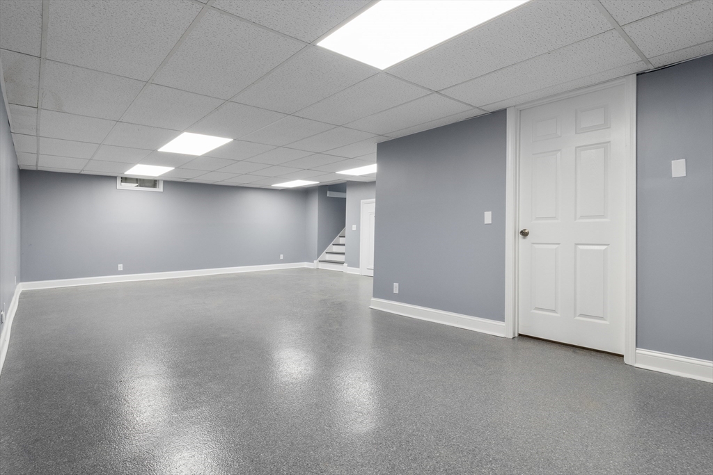 23 East Windsor Road Worthington, MA 01098 - Photo 31 of 40 an empty room with wooden floor and windows