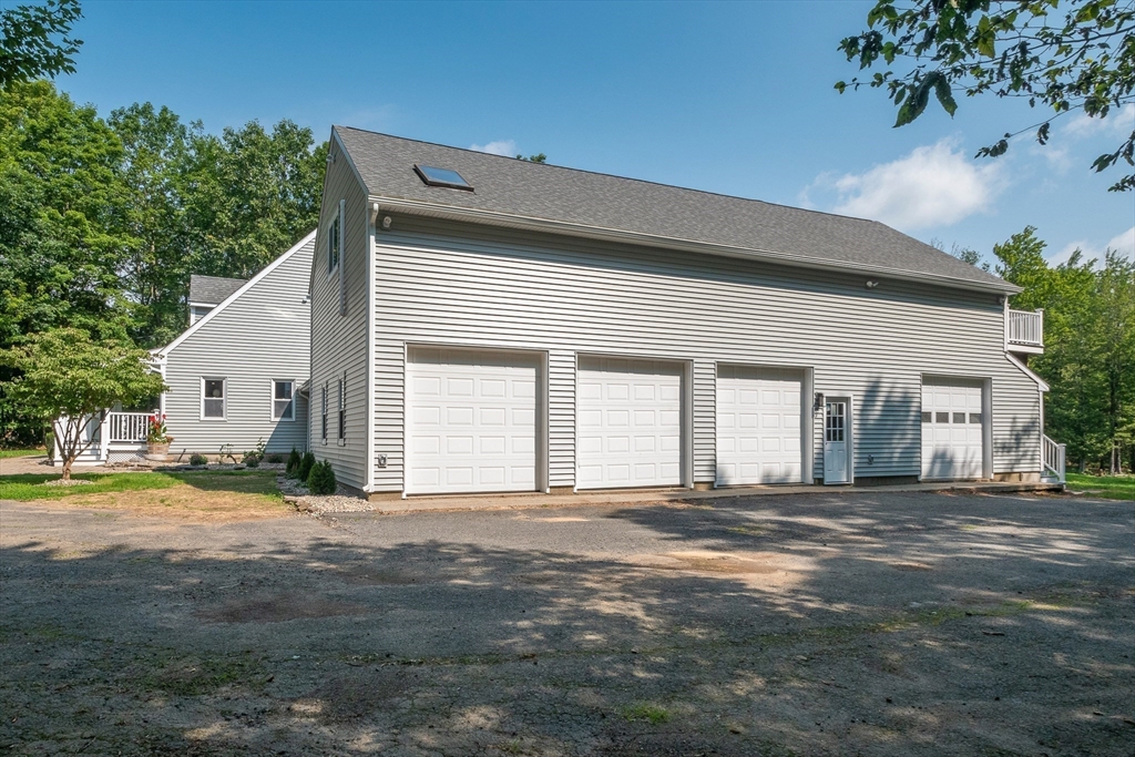 23 East Windsor Road Worthington, MA 01098 - Photo 37 of 40 a front view of a house with a outdoor space