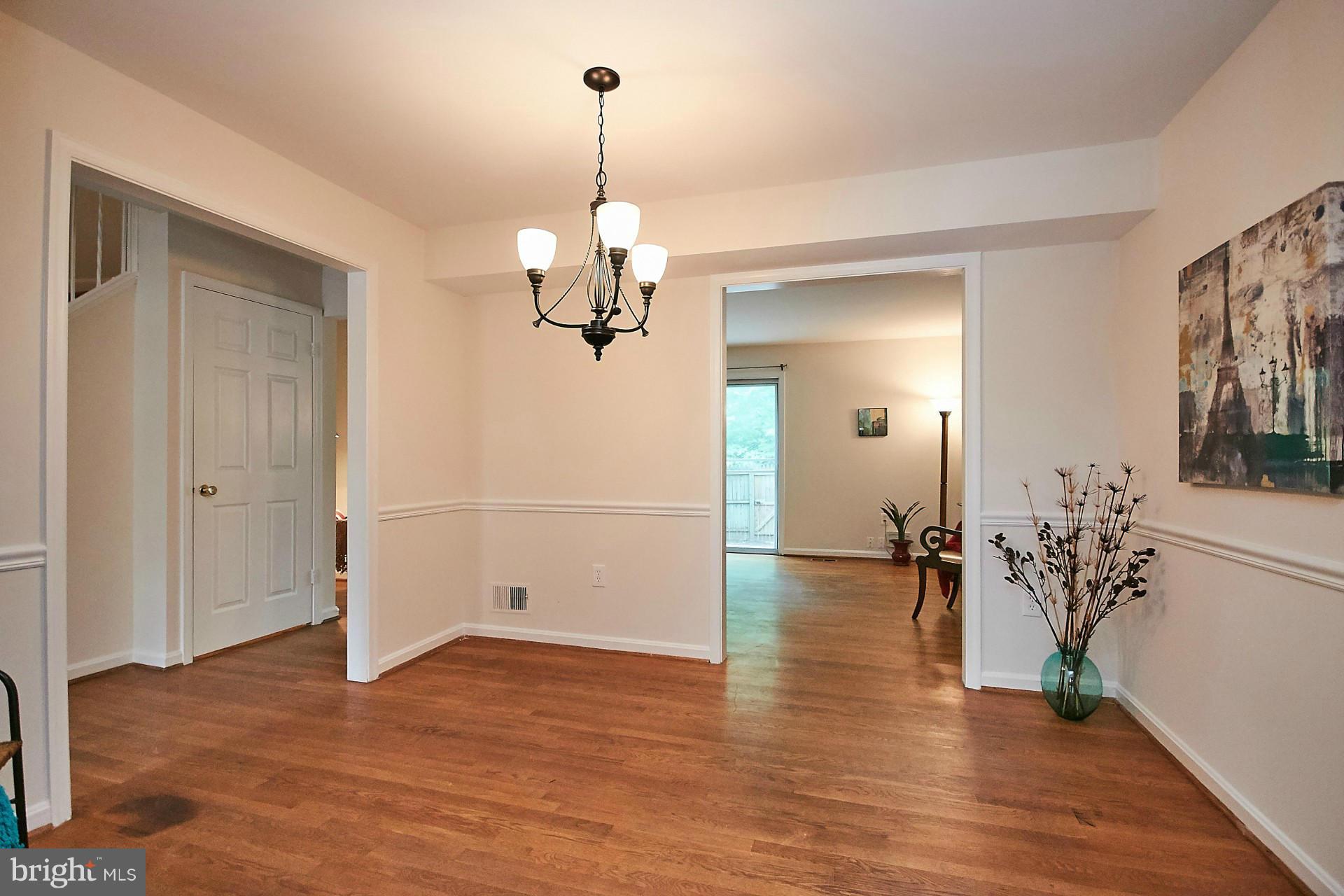 5264 Leestone Court Springfield, VA 22151 - Photo 12 of 30 a view of empty room with wooden floor and ceiling fan