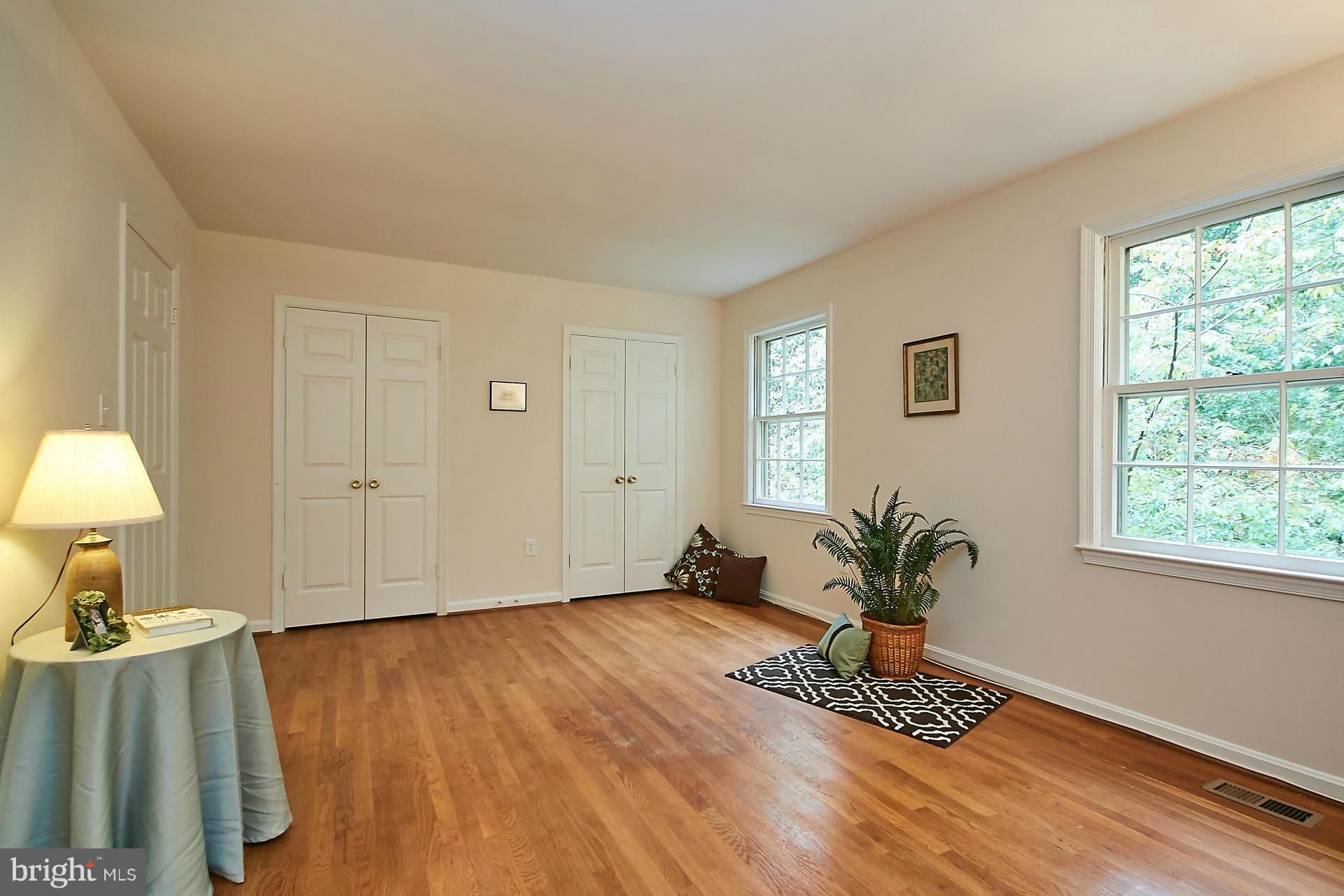 5264 Leestone Court Springfield, VA 22151 - Photo 17 of 30 a view of an empty room with wooden floor and a window