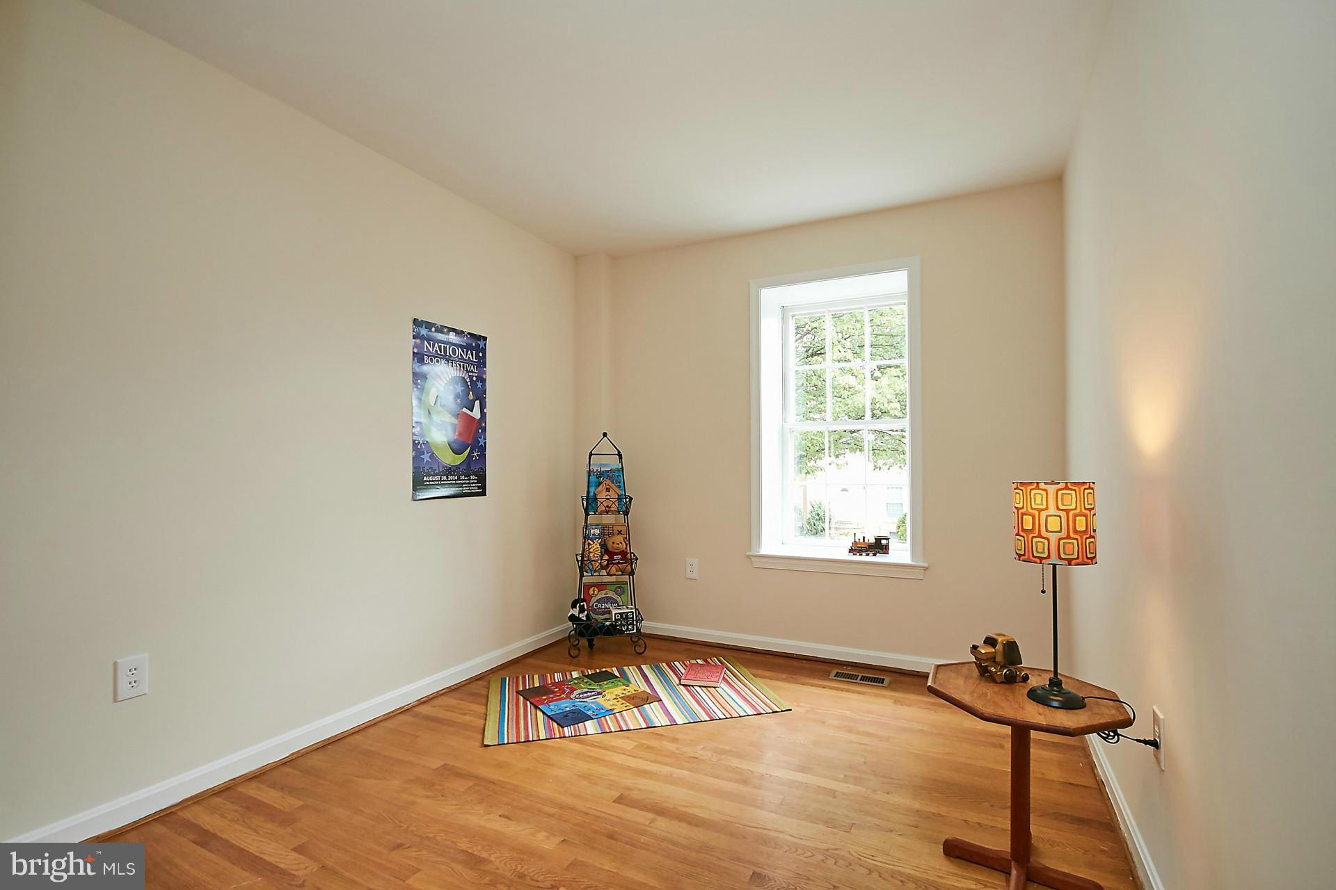 5264 Leestone Court Springfield, VA 22151 - Photo 19 of 30 a view of a livingroom with wooden floor and a window