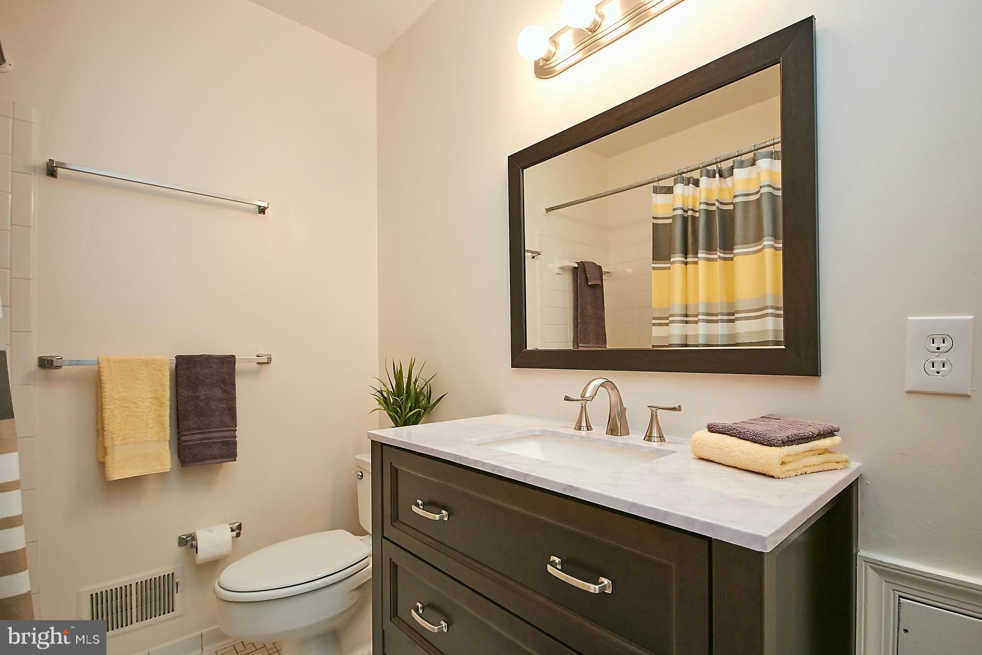 5264 Leestone Court Springfield, VA 22151 - Photo 20 of 30 a bathroom with a sink vanity granite and toilet