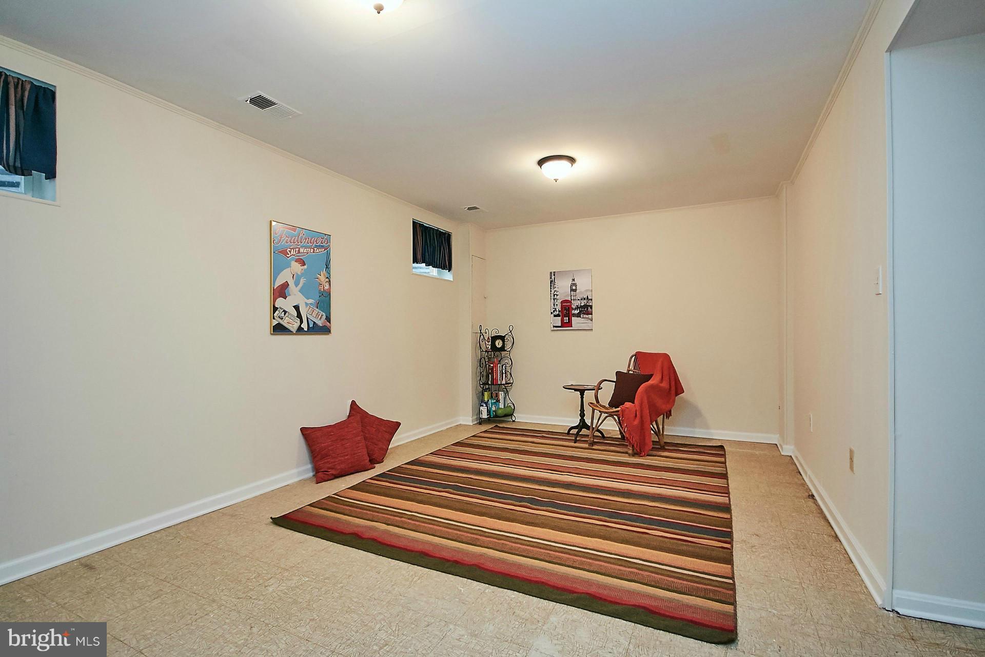 5264 Leestone Court Springfield, VA 22151 - Photo 23 of 30 a bedroom with bed and a chandelier