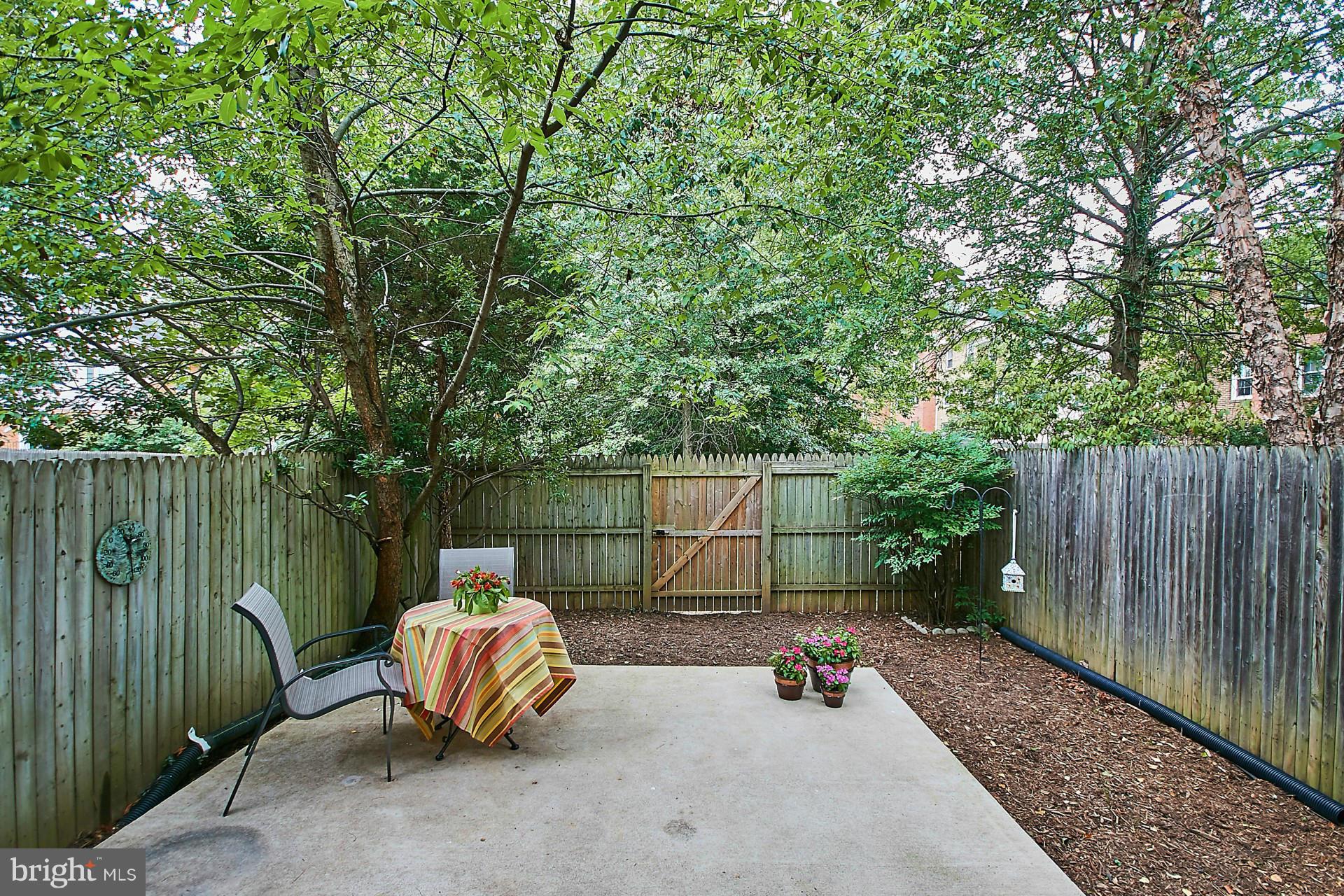 5264 Leestone Court Springfield, VA 22151 - Photo 26 of 30 a backyard of a house with table and chairs