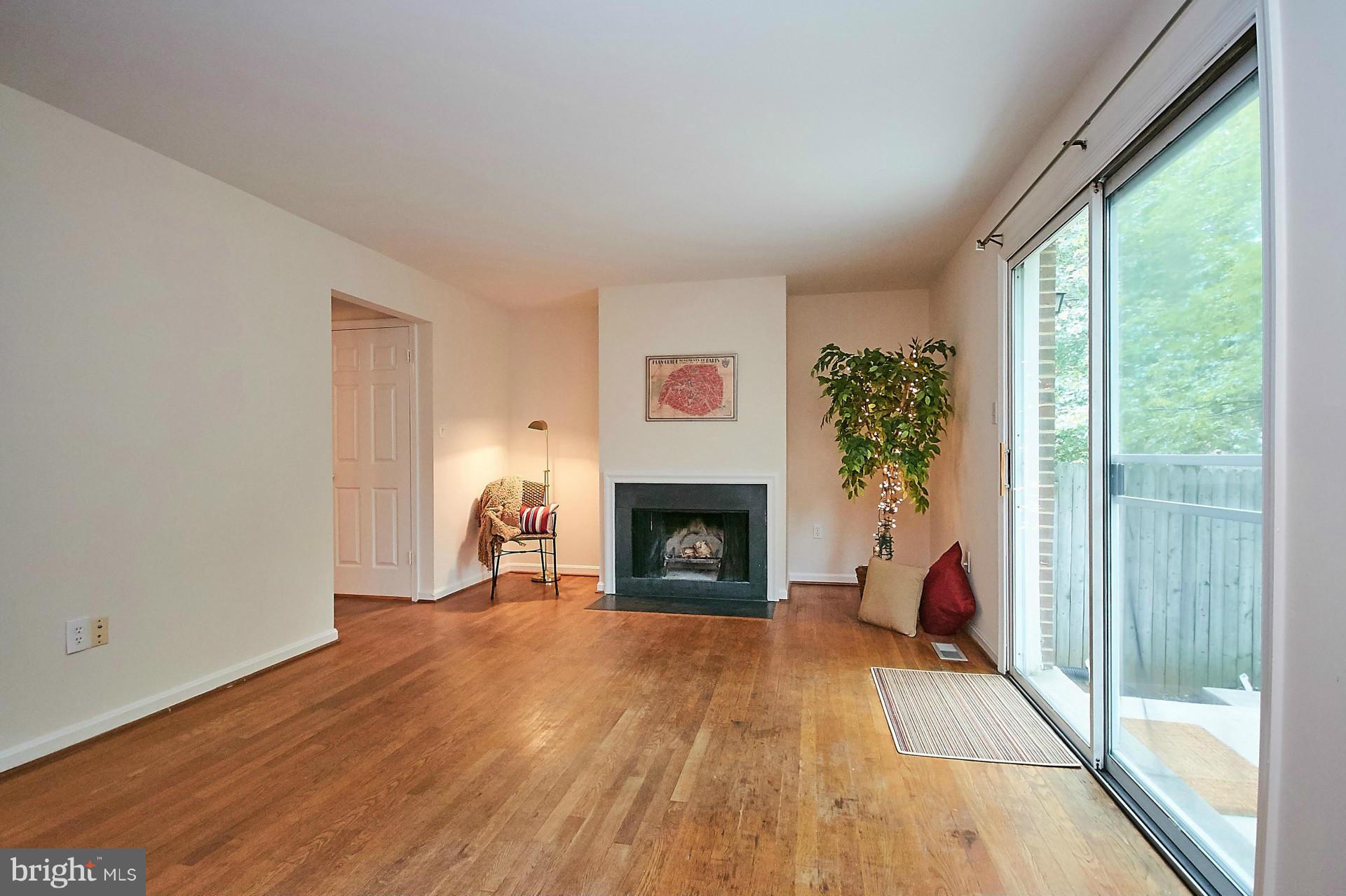 5264 Leestone Court Springfield, VA 22151 - Photo 7 of 30 a view of a livingroom with a fireplace and a fireplace