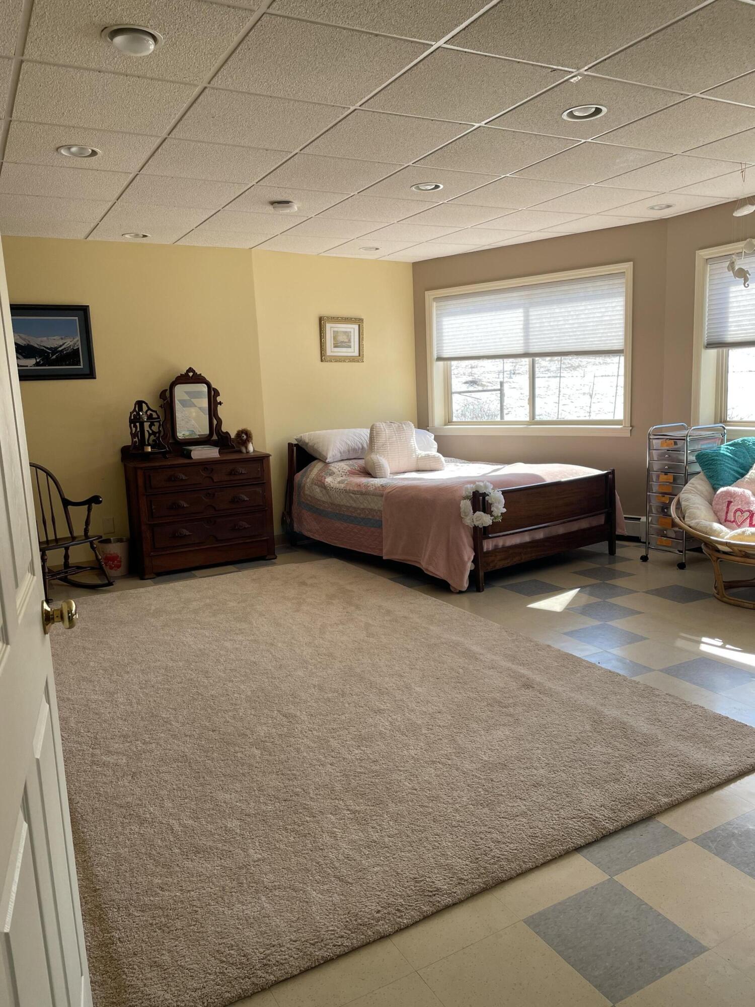 242 Sterling Bridge Road Northwest Willis, VA 24380 - Photo 15 of 32 a spacious bedroom with a bed and a window