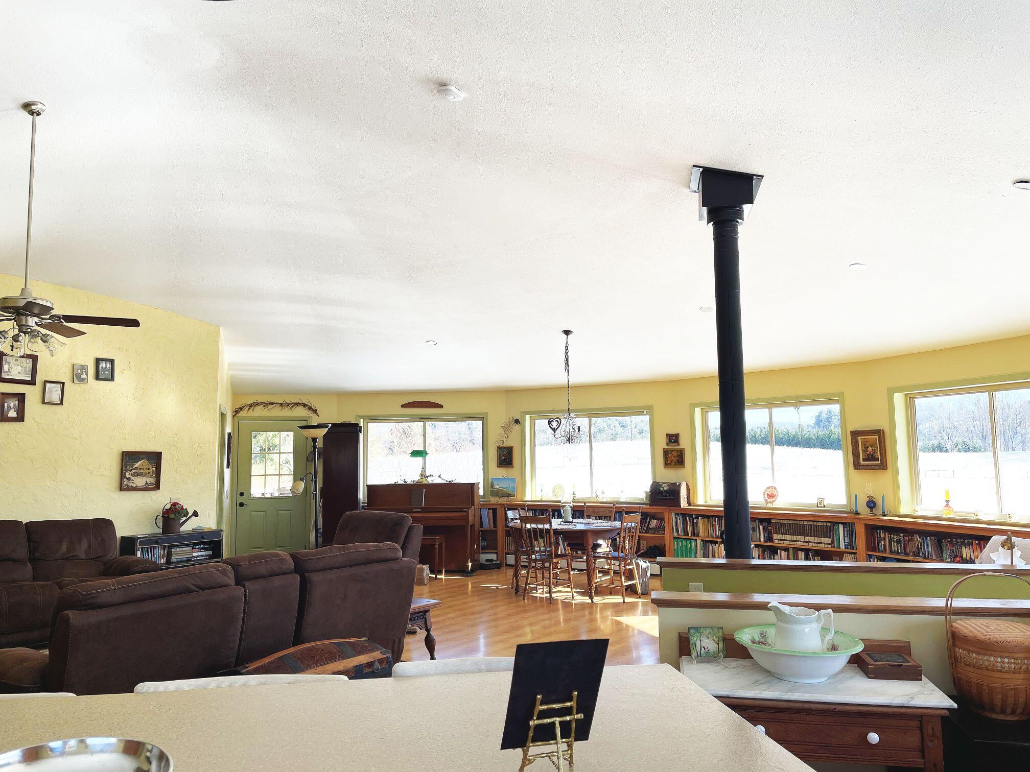 242 Sterling Bridge Road Northwest Willis, VA 24380 - Photo 10 of 32 a living room with furniture and a large window