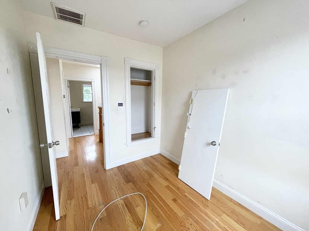 98 L Street, Unit STREET Boston, MA 02127 - Photo 12 of 19 wooden floor in a hall with an entryway