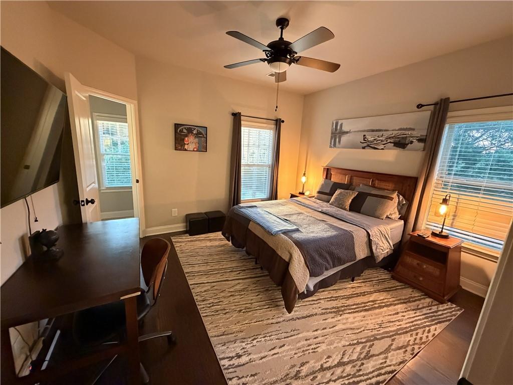 3151 Osborne Road Northeast Brookhaven, GA 30319 - Photo 30 of 54 a bedroom with a large bed a flat tv screen and a telescope
