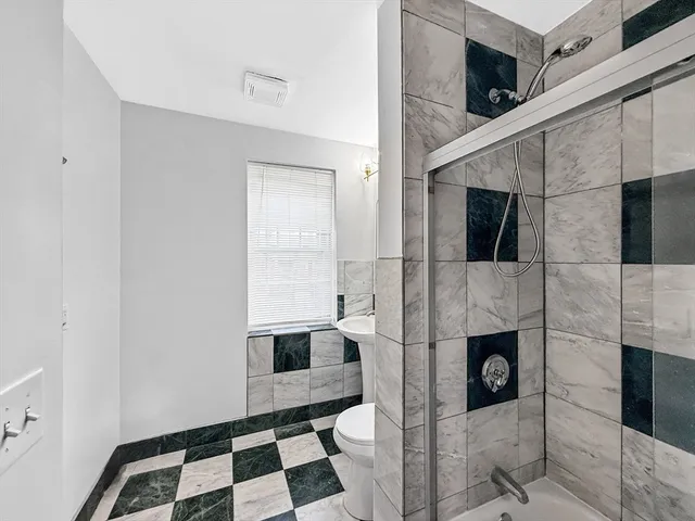 a view of kitchen with a sink and cabinets