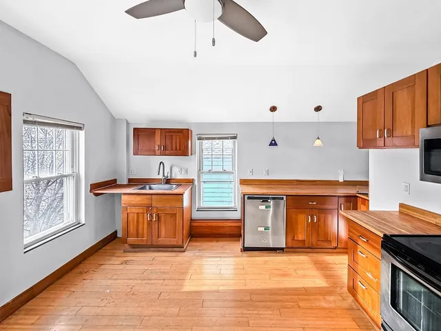 a kitchen with stainless steel appliances granite countertop a stove and a sink