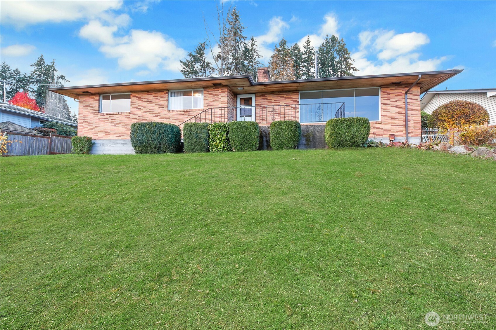 9013 Prentice Avenue Gig Harbor, WA 98332 - Photo 13 of 16 a view of a backyard with plants and a garden