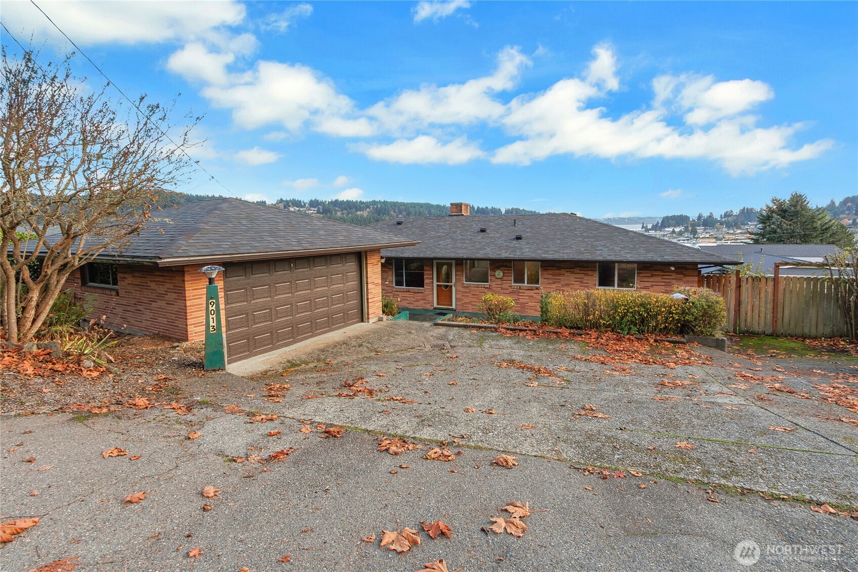 9013 Prentice Avenue Gig Harbor, WA 98332 - Photo 4 of 16 a front view of a house with a yard