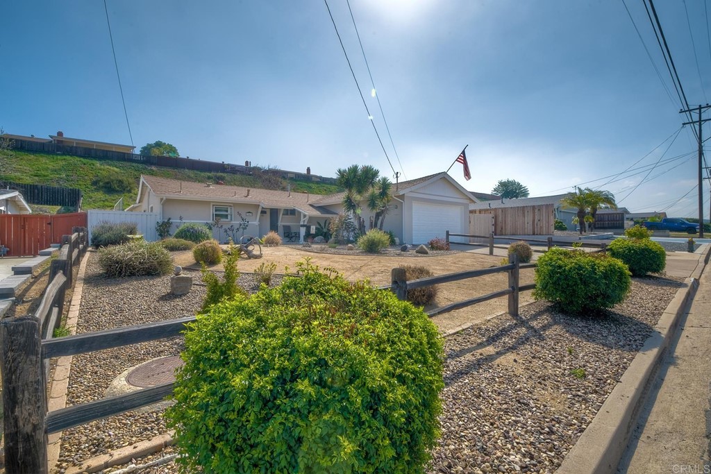 13439 Frame Road Poway, CA 92064 - Photo 1 of 1 a front view of a house with garden