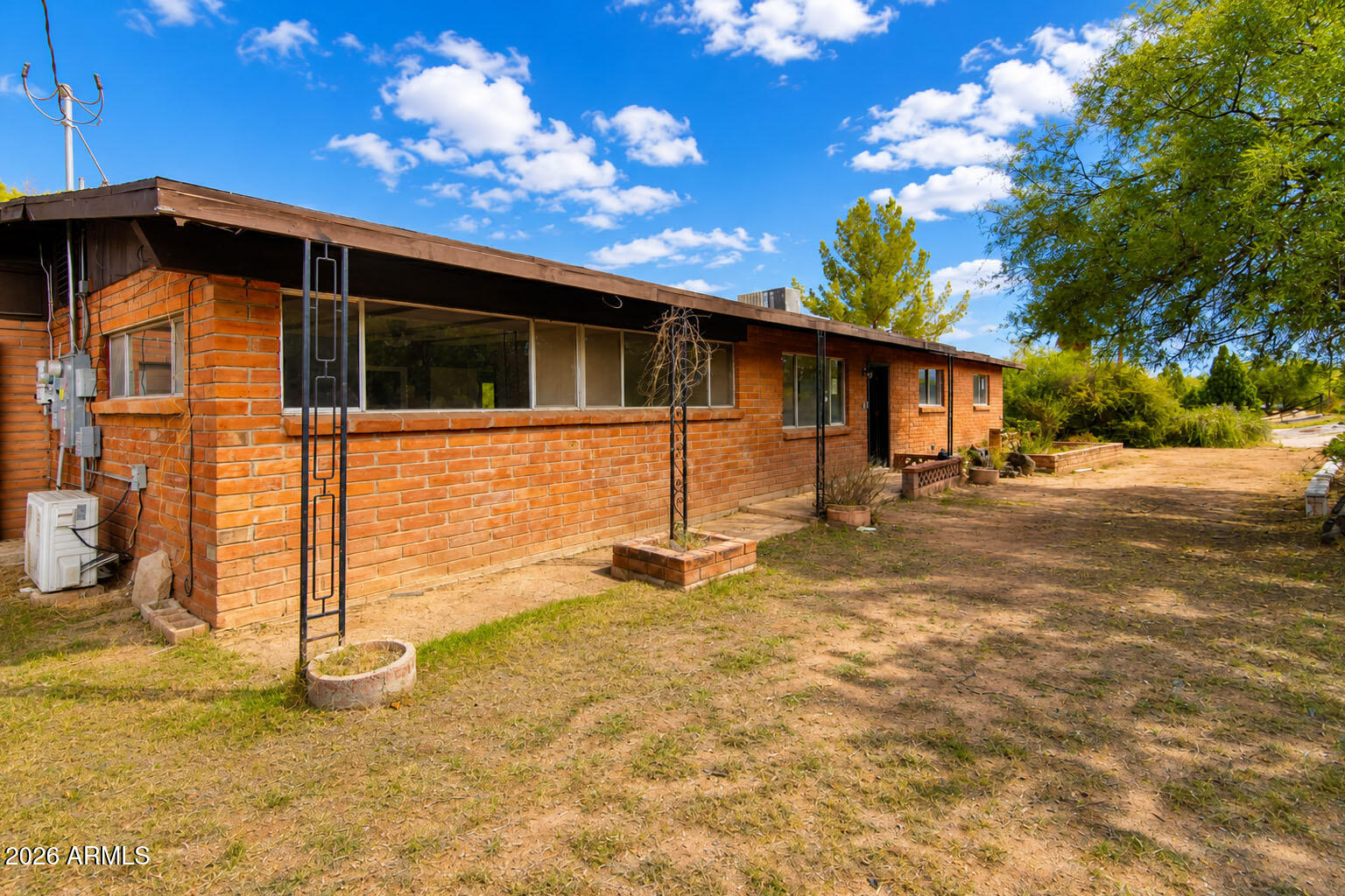 1176 North Royal Road Nogales, AZ 85621 - Photo 2 of 10 a backyard of a house with table and chairs