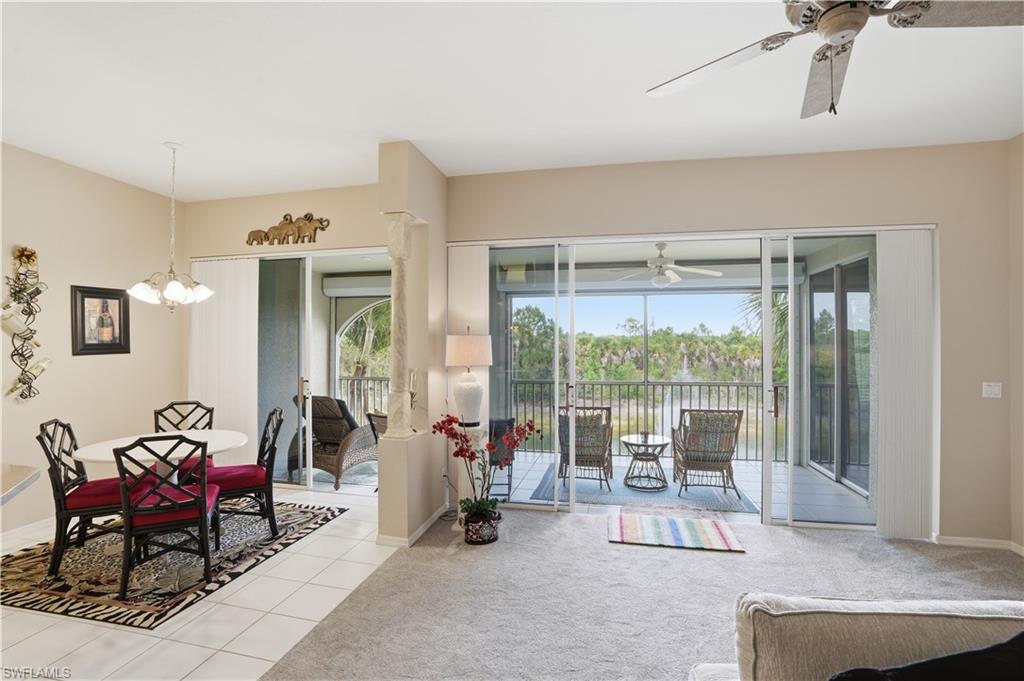 10871 Crooked River Road, Unit 202 Estero, FL 34135 - Photo 11 of 46 a living room with furniture and a large window