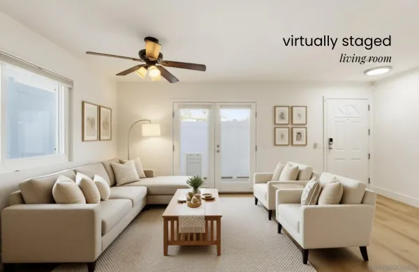 a living room with furniture and a ceiling fan