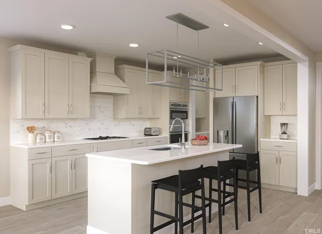 a spacious bedroom with a bed and a couch