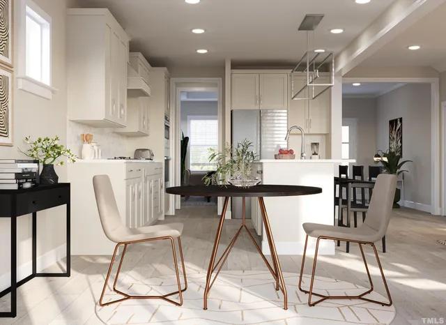 a living room with furniture a flat screen tv and a potted plant