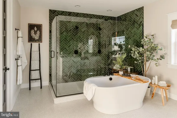 a bathroom with a bathtub and shower