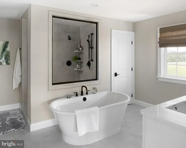 a white bath tub sitting in a bathroom