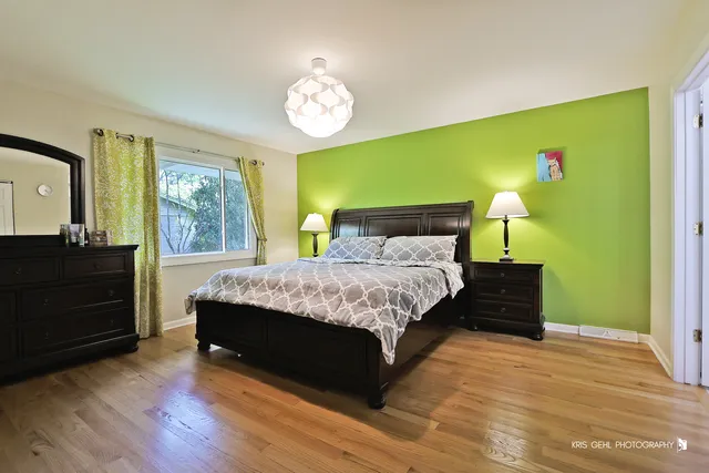 a bedroom with a bed and a dresser