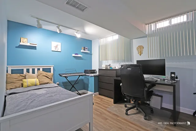 a bedroom with a workspace
