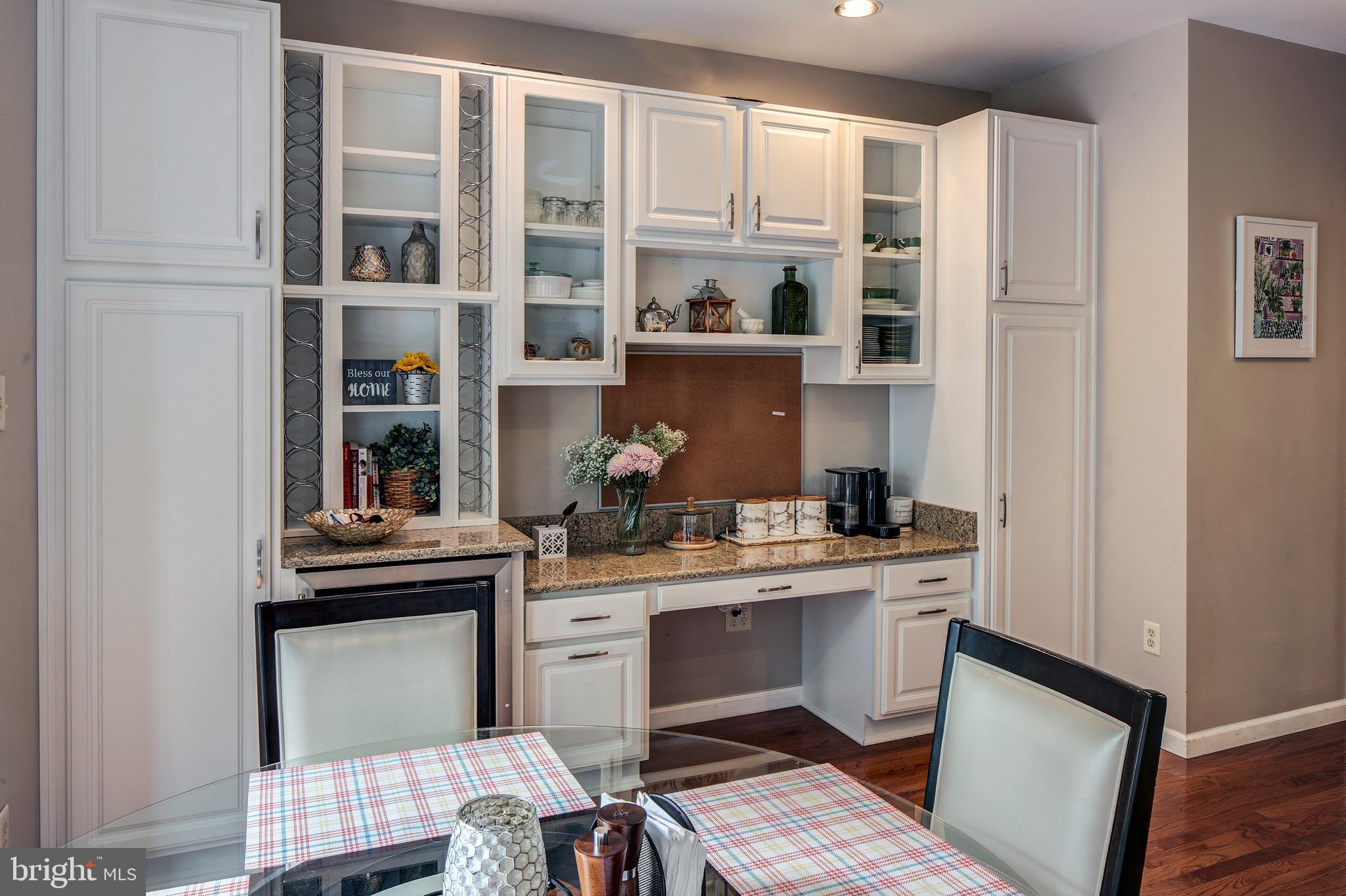 6351 Wind Rider Way Columbia, MD 21045 - Photo 10 of 27 Built in desk, cabinets and bar fridge