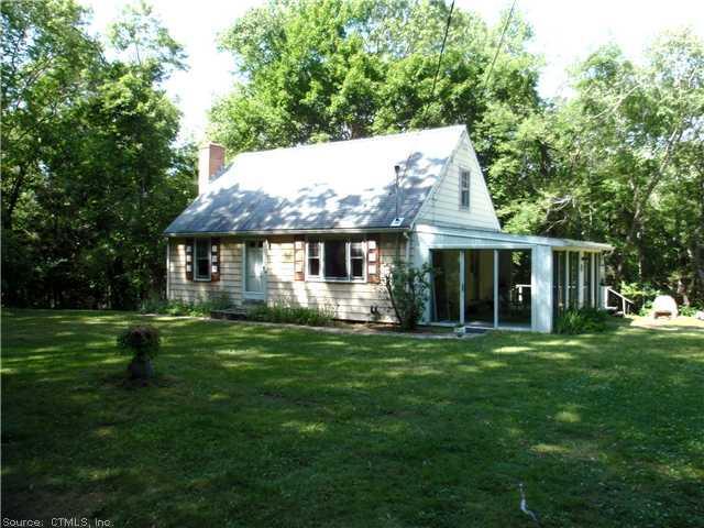 35 Ferry Road Lyme, CT 06371 - Photo 1 of 1 a front view of a house with a garden