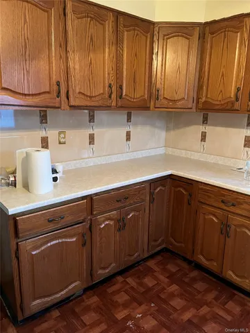 a view of room with stairs and wooden floor