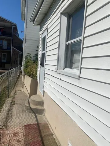 a view of house with outdoor seating