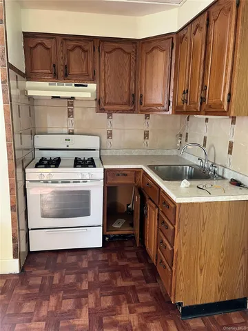 a kitchen with stainless steel appliances a cabinets and a sink