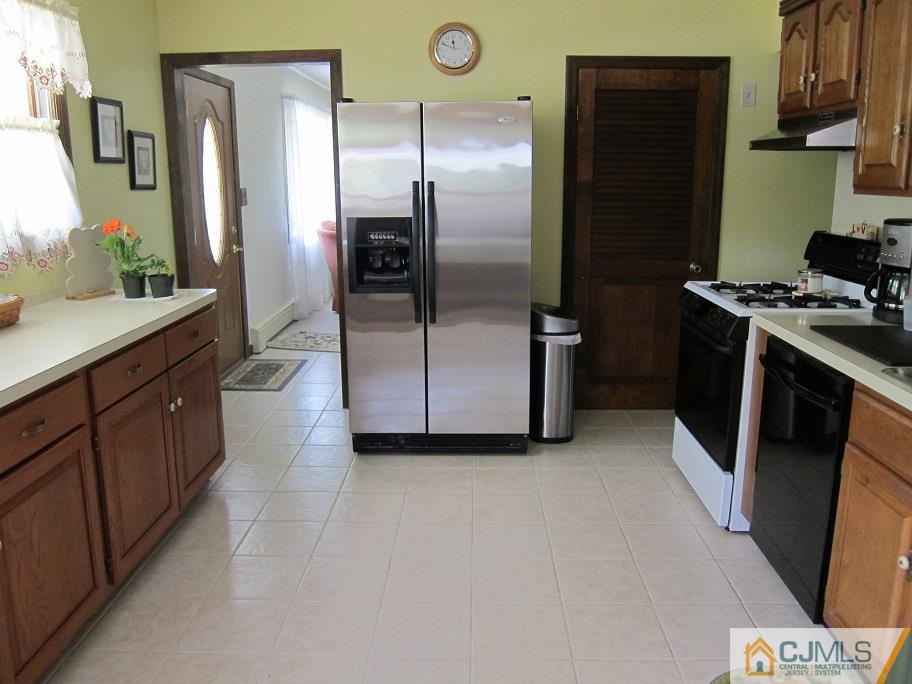 41 Colton Road Edison, NJ 08817 - Photo 3 of 16 a kitchen with stainless steel appliances granite countertop a refrigerator and a stove