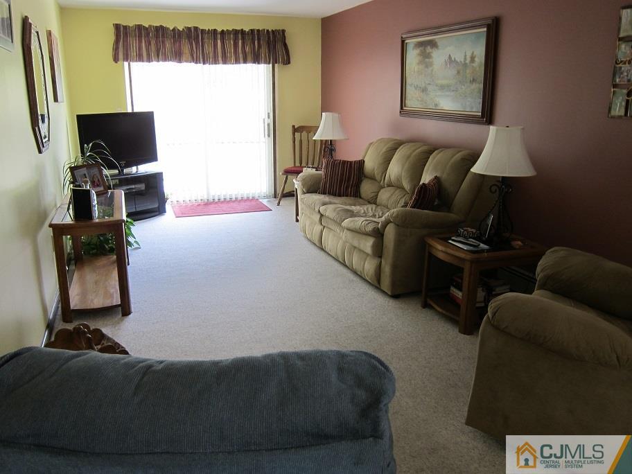 41 Colton Road Edison, NJ 08817 - Photo 9 of 16 a living room with furniture and a flat screen tv