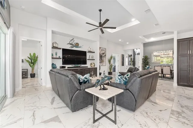 a kitchen with stainless steel appliances kitchen island granite countertop a sink and a stove