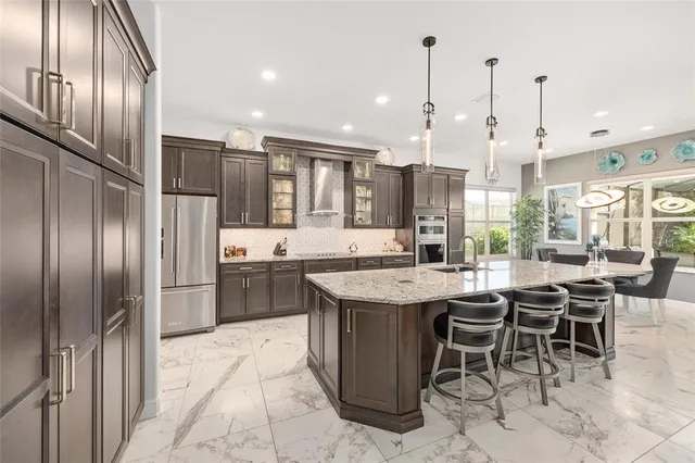 a bedroom with a bed a couch and a potted plant