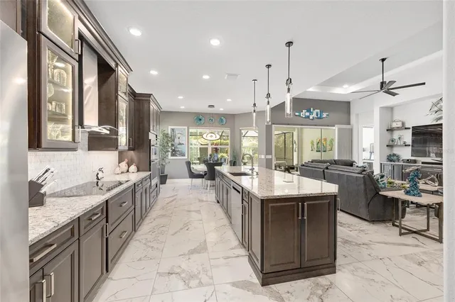 a view of walk in closet with clothes