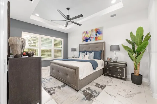 a spacious bathroom with a granite countertop sink and a mirror