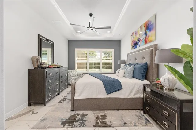 a bed room with a bed and a chair