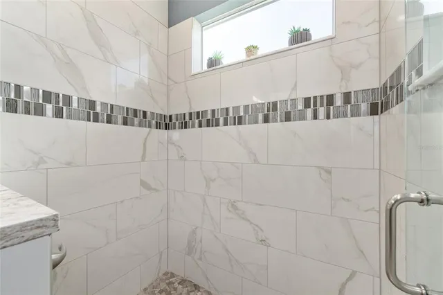 a view of a patio with a table and chairs under an umbrella