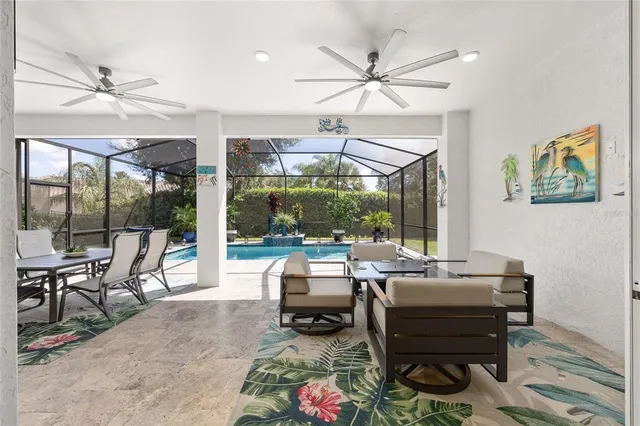 a view of a backyard with a garden and outdoor seating