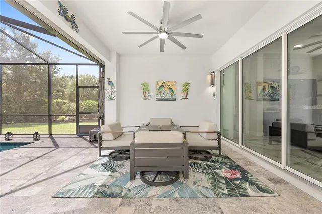 a front view of a house with swimming pool having outdoor seating