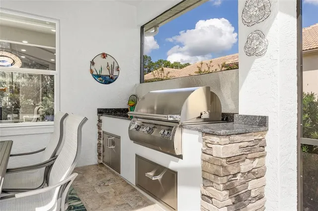 an aerial view of a house with yard