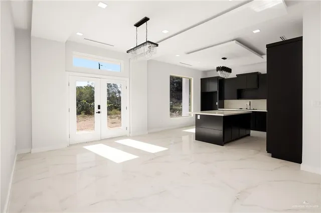 a large bathroom with a large tub shower and sink