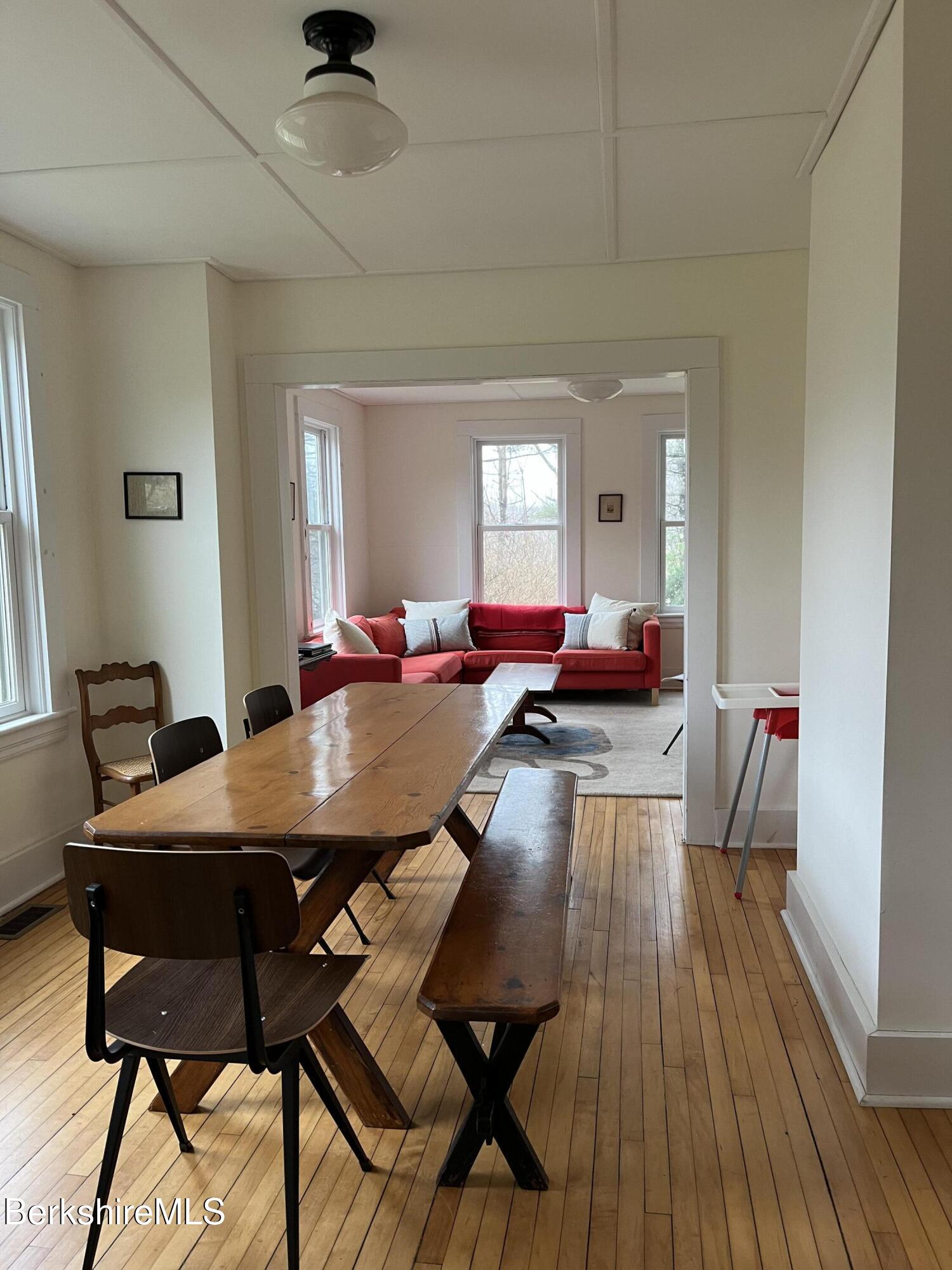 86 Miner Road Lanesborough, MA 01237 - Photo 30 of 44 a view of a dining room with furniture window and wooden floor