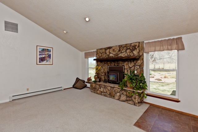 3464 G Road Clifton, CO 81520 - Photo 11 of 42 a living room with furniture and a fireplace
