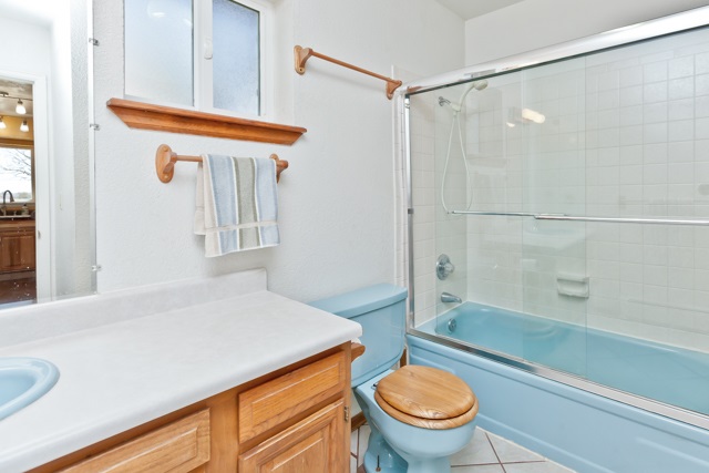 3464 G Road Clifton, CO 81520 - Photo 26 of 42 a bathroom with a sink a toilet a mirror and shower