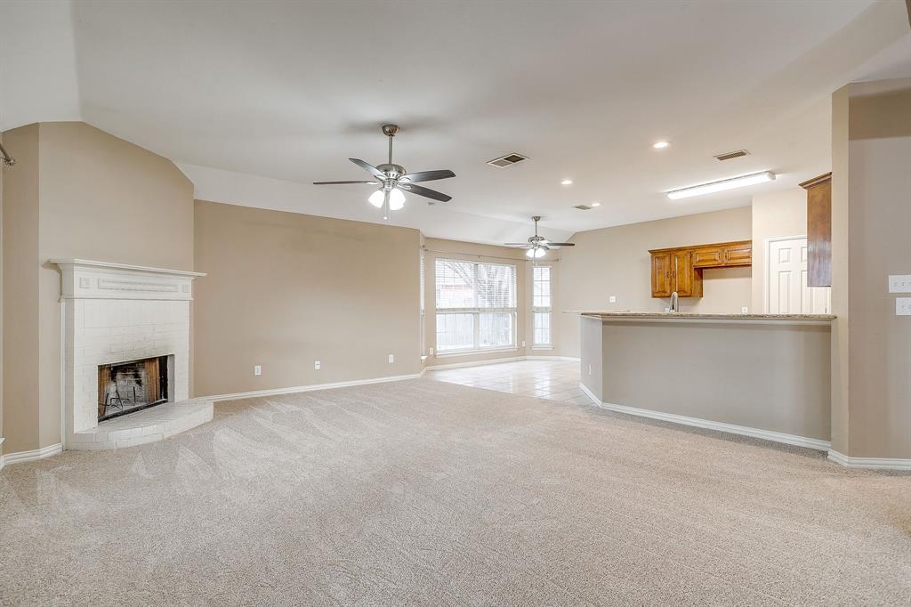 177 Aspen Loop Aledo, TX 76008 - Photo 18 of 40 a view of a kitchen with a sink and a fireplace
