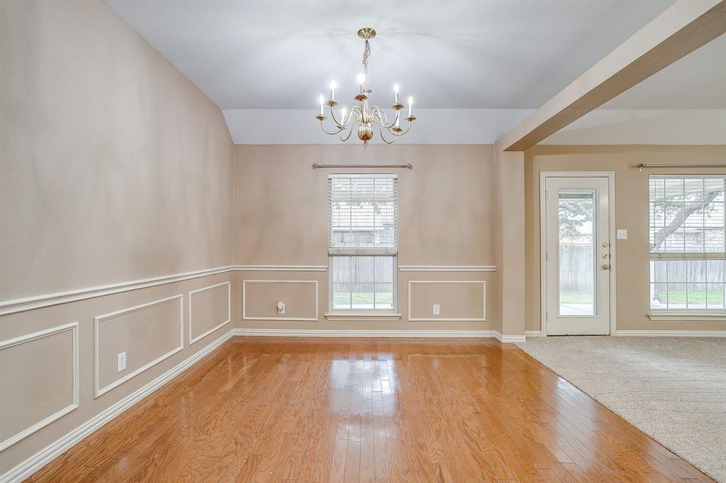 177 Aspen Loop Aledo, TX 76008 - Photo 22 of 40 wooden floor in an empty room with a window